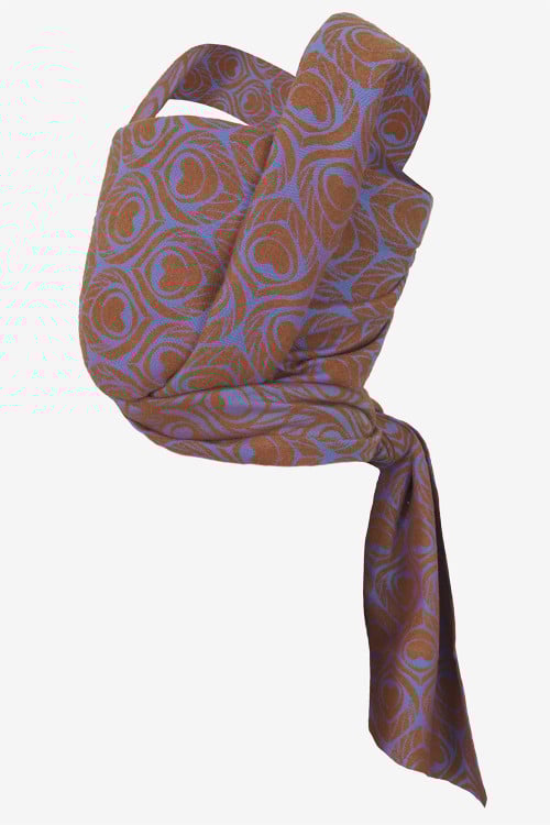 Brown with an iridescent violet-blue hue baby wrap with peacock feather print in vicuña and silk blend